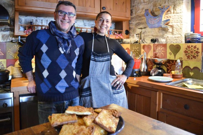 Lila and Pavlos with Lila’s signature pie, “kasiopita” or “alevropita”, a simple yet delicious comfort food.